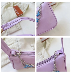 Detailed views of purple shoulder bag featuring silver chain and blue butterfly charm