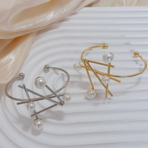 Modern irregular geometric bracelets in gold and silver finish with pearl embellishments
