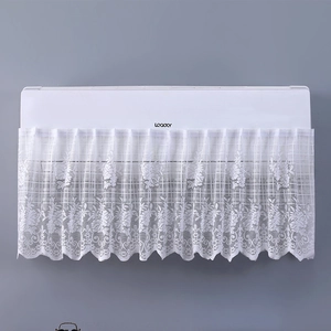 Detailed view of white floral lace air conditioner cover with scalloped edge embroidery