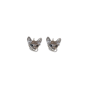 Silver cat ear studs with black gemstones and delicate chains in a minimalist style