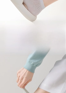 Close-up of white mesh silk socks showing high elasticity and breathable texture