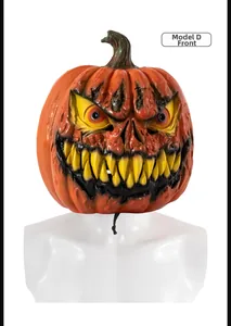 Detailed view of scary Halloween pumpkin latex mask with sharp fangs and realistic texture