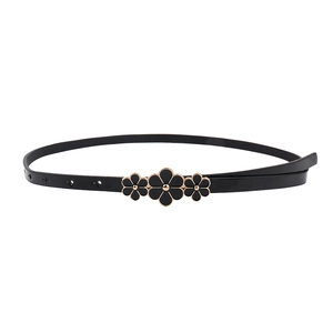 Slim black waist belt with polished finish and three connected gold floral buckle details