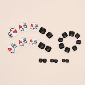 Black and white heart pattern press-on toe nails with cute matte finish and lettering