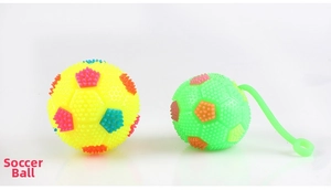 Detail of spiked massage toy soccer balls in yellow and green with colorful rubber tips
