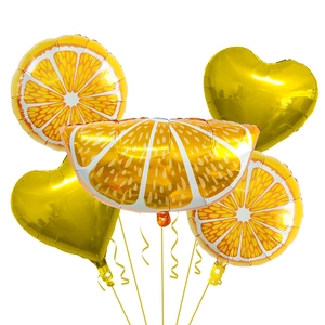 Detail of orange slice and gold heart foil balloons for summer birthday party decor