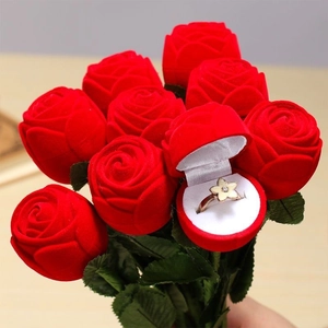 Romantic velvet red rose jewelry box for rings hidden within a realistic flower bouquet