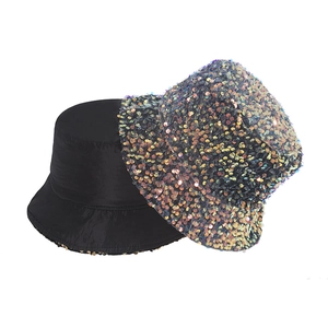 Detailed comparison of a black matte bucket hat and a shimmering multi-color sequined sun hat