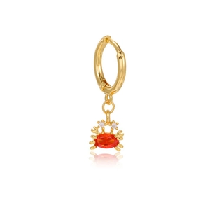 Detail of 18K gold crab earring with red gemstone inlay and white zircon eyes
