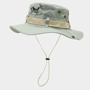 Detail of light green bucket hat with embroidered dog motif and adjustable windproof cord