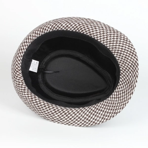 Detail of label showing 58cm size and houndstooth fabric blend on jazz fedora hat