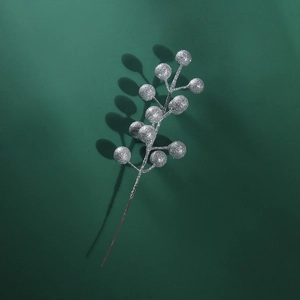 Macro shot of silver glitter artificial berry branch for Christmas festive home decoration
