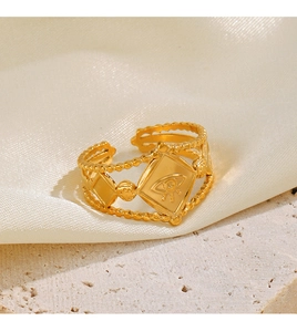 Macro shot of gold adjustable evil eye ring with rhombus detail and beaded texture edges