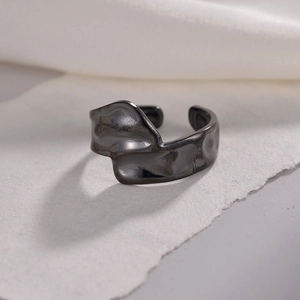 Adjustable dark metal open ring featuring irregular lava ripple texture in vintage style