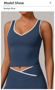 Detail view of the Badge Blue racerback sports bra with white contrast trim and V-neckline