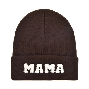 Detailed view of the white towel embroidered MAMA letters on a dark brown knit beanie