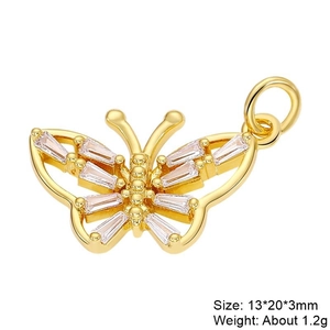 Detail of butterfly jewelry pendant in gold with baguette-cut clear zircon stones