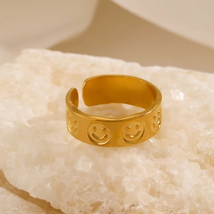 Minimalist gold plated open ring with engraved smiley face patterns on crystal rock