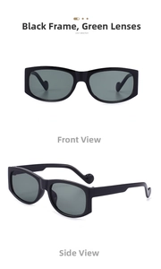 Close-up of black rectangular sunglasses with green lenses and unique spherical temple tips