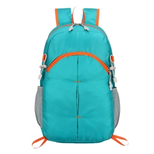 Foldable lightweight hiking backpack in bright blue with orange contrast and ripstop fabric