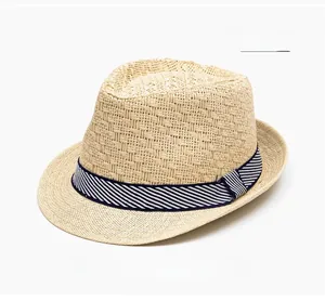 Close-up of beige straw fedora hat featuring breathable weave and striped band detail