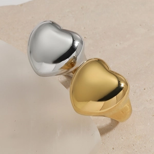 Minimalist 316 stainless steel heart ring in gold and silver with a polished finish