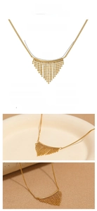 Detailed view of bohemian fan-shaped tassel pendant in 18k gold plated stainless steel