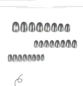 Detailed set of cat-eye silver grey press-on nails in various sizes on white background
