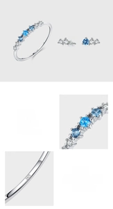 Macro detail of S925 sterling silver ring and stud earrings with blue zirconia