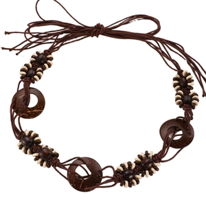 Bohemian braided waist chain with ethnic wooden beads and round shells on white background