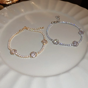 Elegant rose flower bracelets in gold and silver finish featuring zircon pave chain links