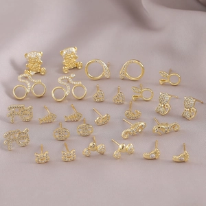 Set of minimalist golden animal stud earrings with sparkling cubic zirconia micro-inlay