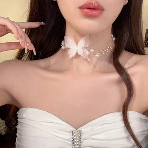 Elegant butterfly pearl choker necklace with white lace bow and delicate beaded strand
