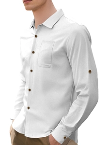 Detail of white linen shirt showing chest pocket and dark wood buttons on model