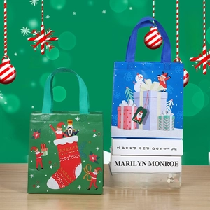 Green and blue Christmas non-woven gift bags with nutcracker and snowman prints
