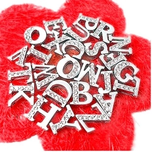 Close-up of 8mm silver alloy letters A-Z with white rhinestones for DIY wristbands