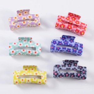 Set of six colorful floral square hair claws in purple, pink, green, blue, and yellow