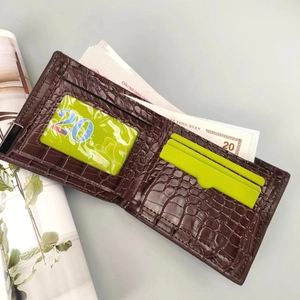 Detailed interior of brown crocodile pattern wallet showing card slots and compartments