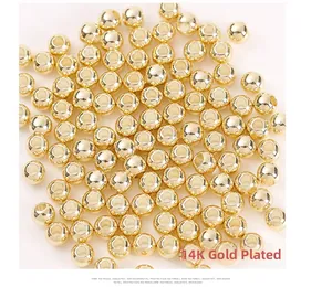 Detailed close-up of 14K gold plated solid copper beads for DIY jewelry making