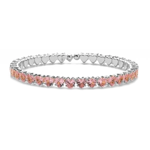 Detailed macro view of pink heart-shaped crystal bracelet with silver base plating