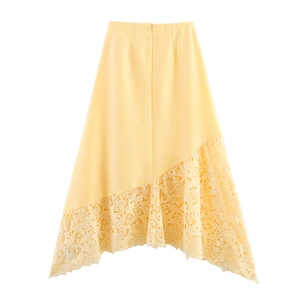 Detail of elegant light yellow skirt featuring asymmetrical lace splicing and texture