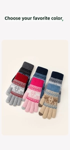 Detail showing various colors of knitted winter gloves with classic snowflake pattern