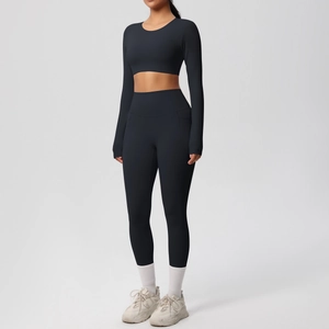 Detail of high-stretch double-sided brushed fabric on black two-piece yoga fitness set