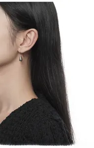 Minimalist S925 sterling silver water drop earrings shown on model for elegant dangle effect