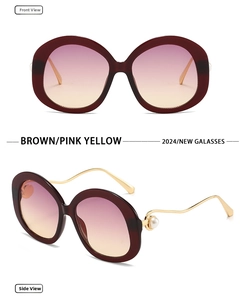 Detail of oversized wine red round sunglasses with pearl accents and gradient lenses