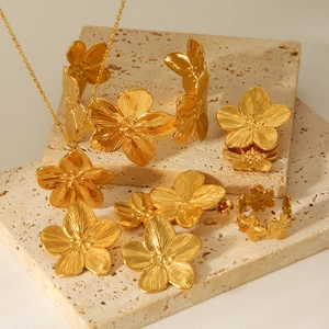 Elegant gold five-petal flower jewelry set including necklace, bracelet, earrings and ring
