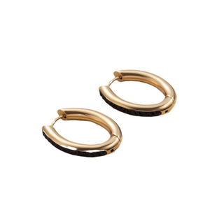 Gold oval hoop earrings with black micro-pavé diamonds on minimalist stainless steel