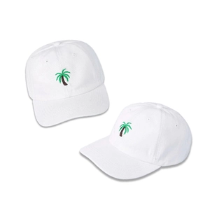 White baseball cap with green palm tree embroidery featuring a classic curved brim design