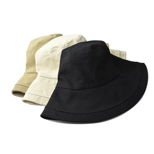 Set of minimalist cotton bucket hats in black, beige, and khaki for sun protection