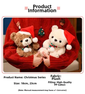 Detail of plush Christmas teddy bear with scarf showing soft fabric and holiday styling